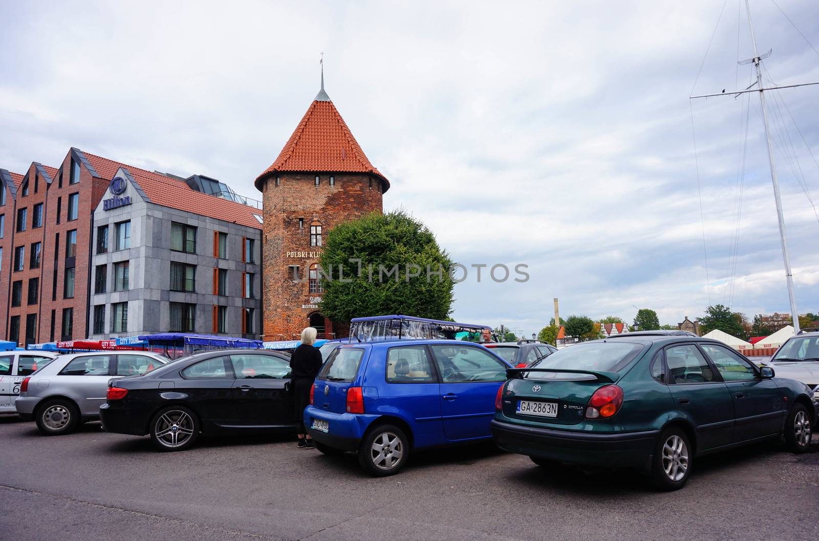 GDANSK, POLAND - JULY 29, 2015: Parked cars close by a Hilton hotel