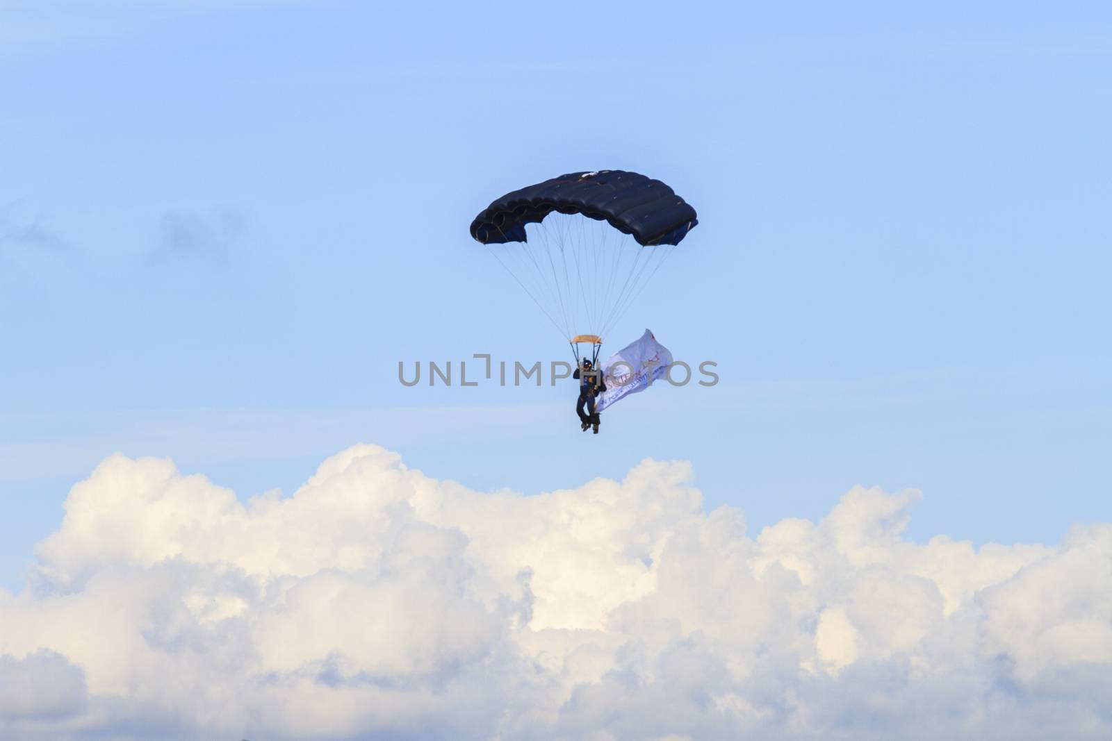 ENGLAND, Southport: A pilot parachutes through the air during the Southport Airshow 2015 in Southport, Merseyside in England on September 19, 2015