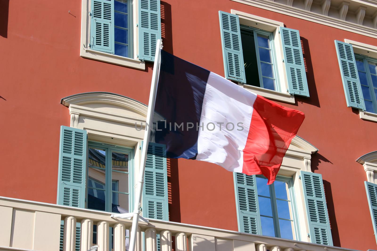 French Flag at Facade of Historic Building in the City of Nice, France