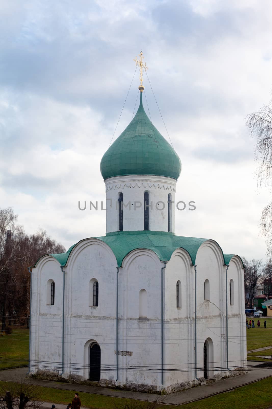 White orthodox church with green dome
