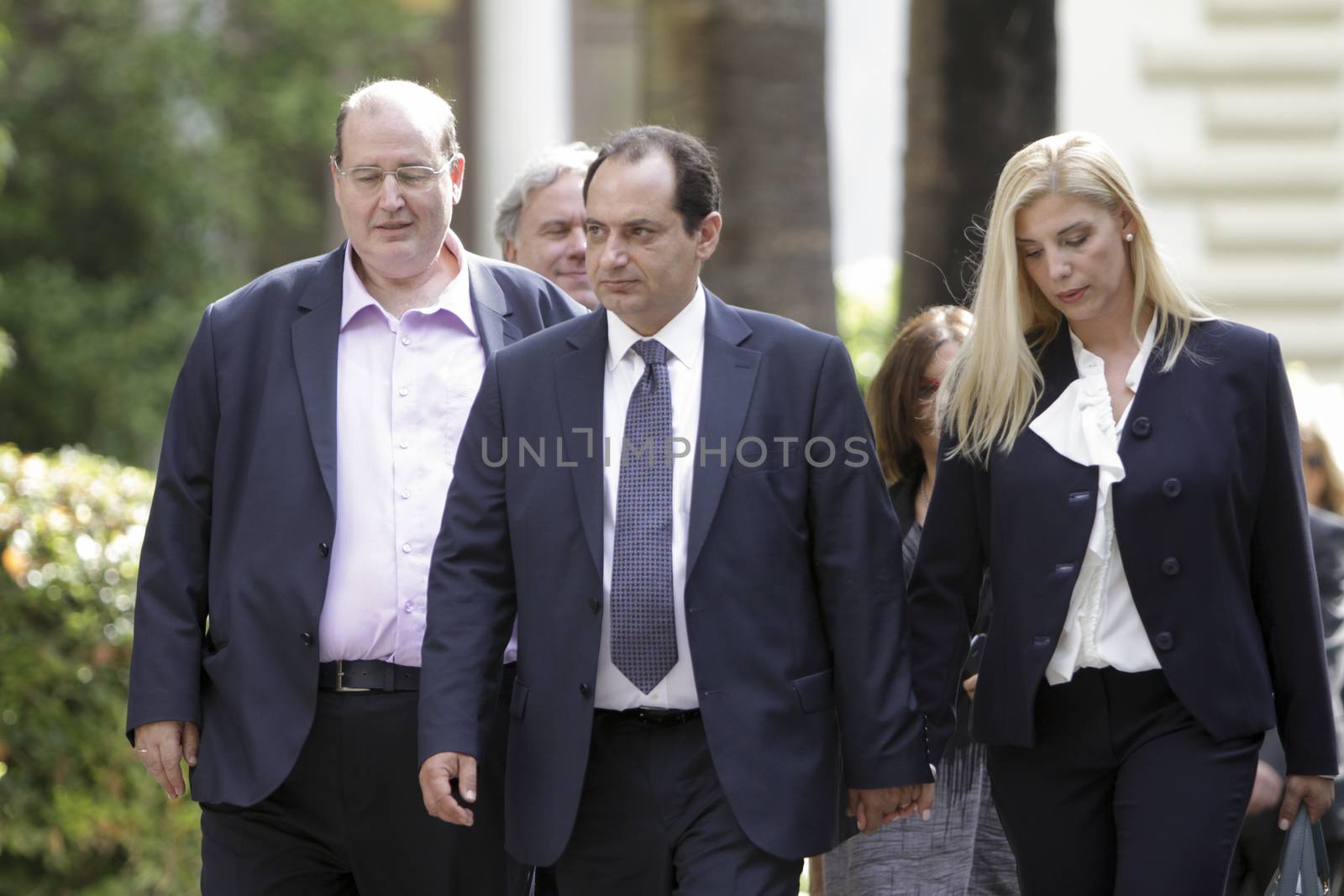 GREECE, Athens: Greek Government ministers leave the Presidential Mansion after the swearing-in ceremony in Athens, Greece on September 23, 2015. The ceremony took place at the Presidential Mansion, three days after the victory of SYRIZA (Coalition of the Radical Left) in the second Greek General Election in eight months.The implementation of the bailout, agreed after months of bitter negotiations, will be the government's overwhelming task.