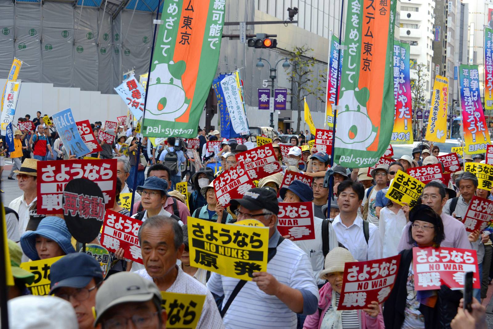 JAPAN, Tokyo : Thousands of people protest in Tokyo outside of Japan's parliament against new legislation that would allow the military to deploy overseas on September 23, 2015. The changes would allow Japanese troops to fight abroad for the first time since World War Two. 