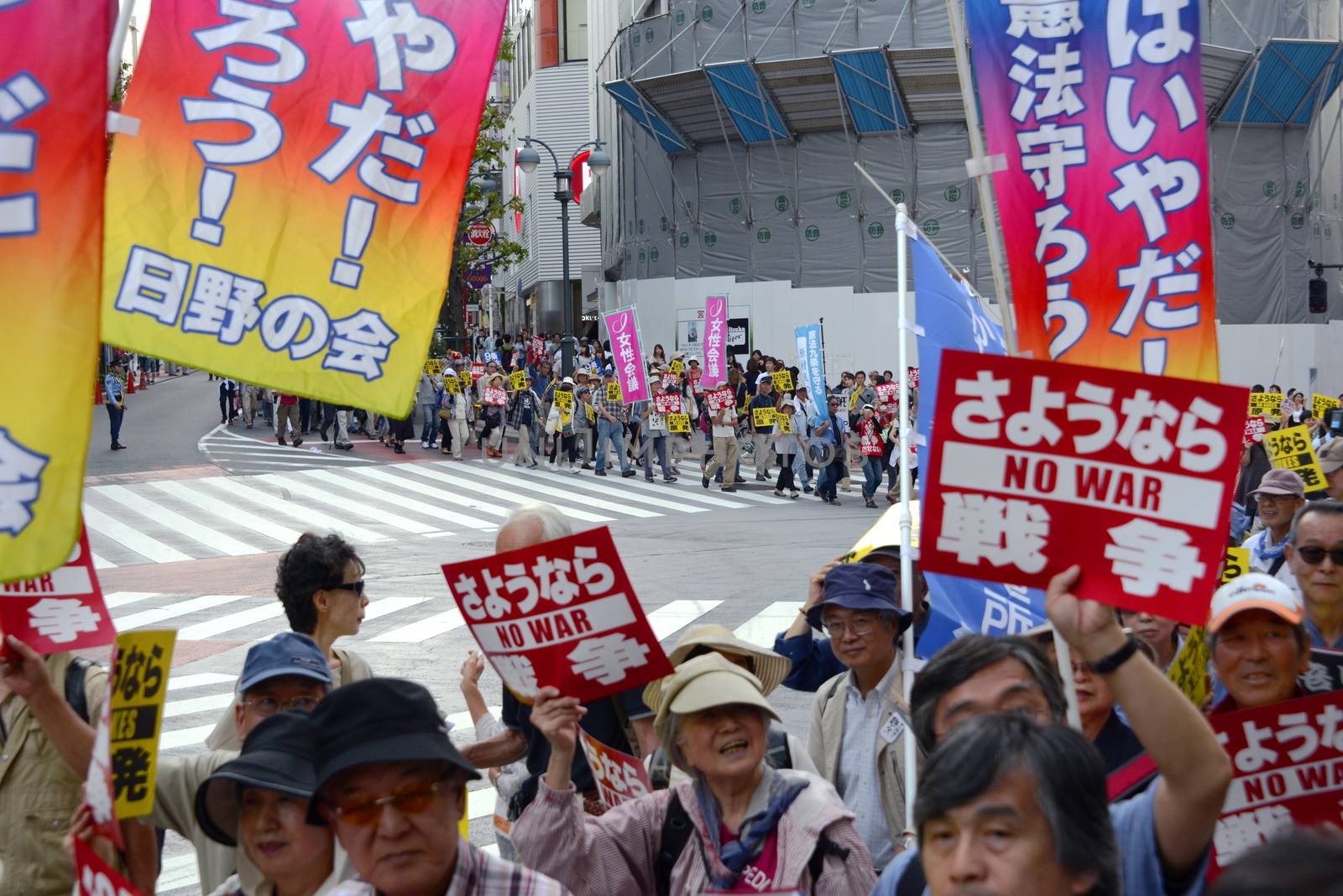 JAPAN, Tokyo : Thousands of people protest in Tokyo outside of Japan's parliament against new legislation that would allow the military to deploy overseas on September 23, 2015. The changes would allow Japanese troops to fight abroad for the first time since World War Two. 