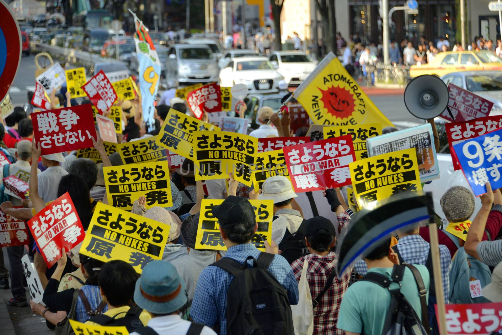 JAPAN, Tokyo : Thousands of people protest in Tokyo outside of Japan's parliament against new legislation that would allow the military to deploy overseas on September 23, 2015. The changes would allow Japanese troops to fight abroad for the first time since World War Two. 