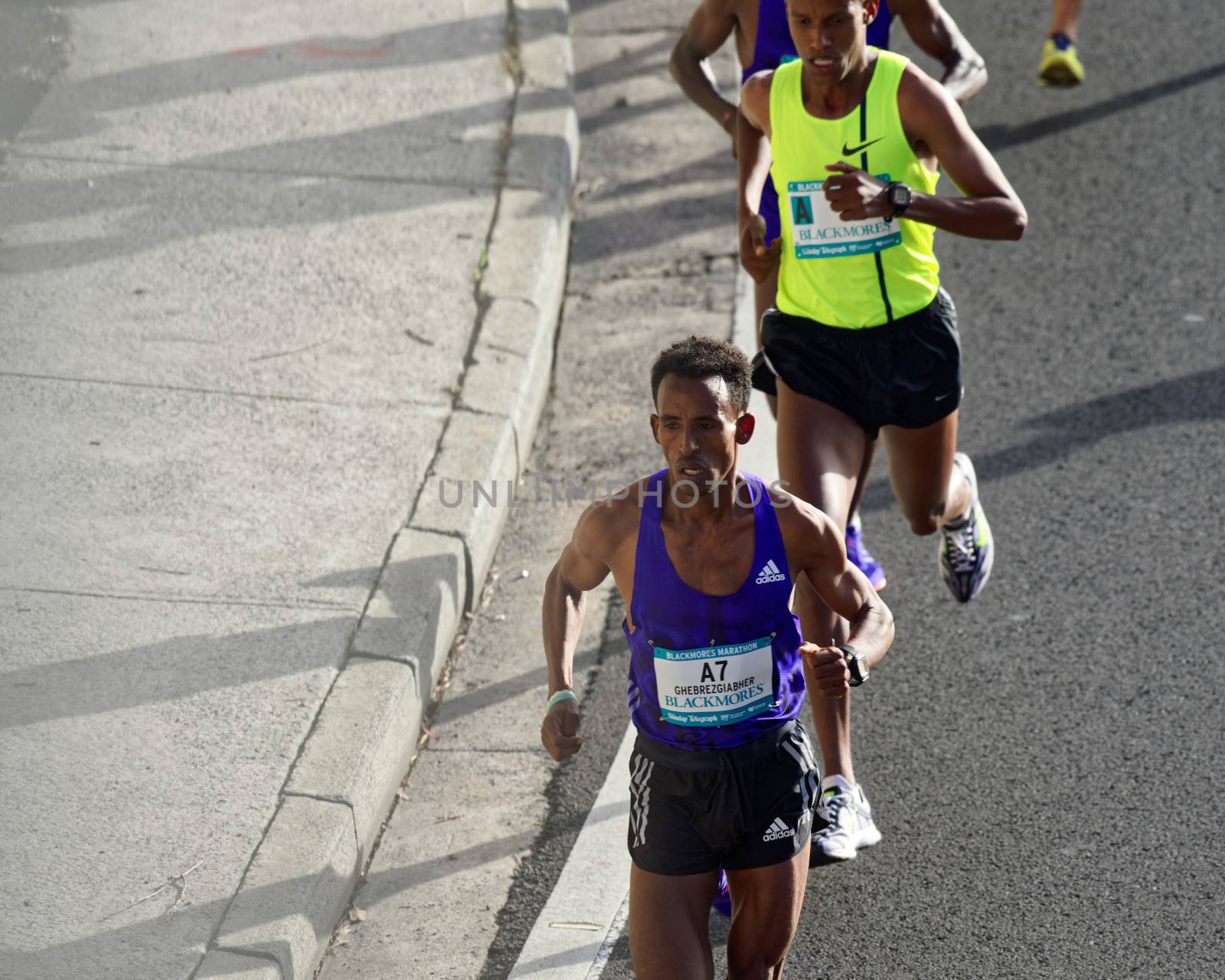 AUSTRALIA, Sydney: Eritrean Kibrom Ghebrezgiabhier runs in the Sydney Marathon held during the Sydney Running Festival on September 20, 2015. Around 30,000 participants took part in the 15th Sydney Running Festival which incorporates a 42km marathon, a half marathon, a 9km bridge run as well as a 3.5km family fun run