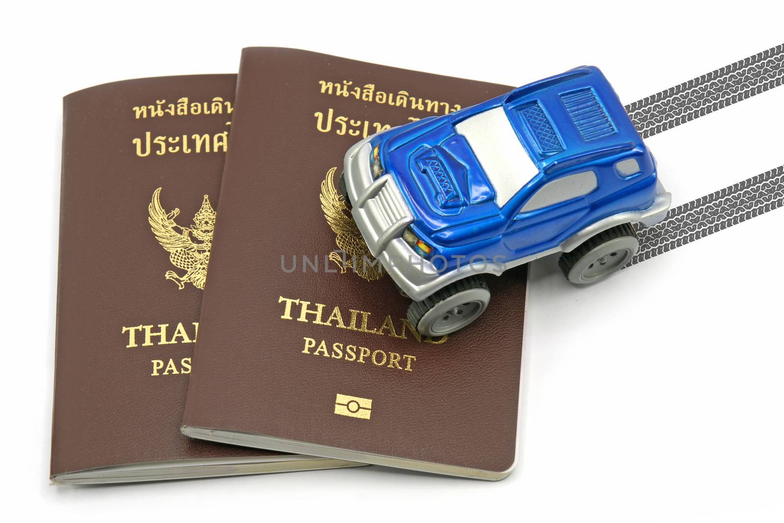 Thailand passport and blue 4wd car for travel concept by mranucha
