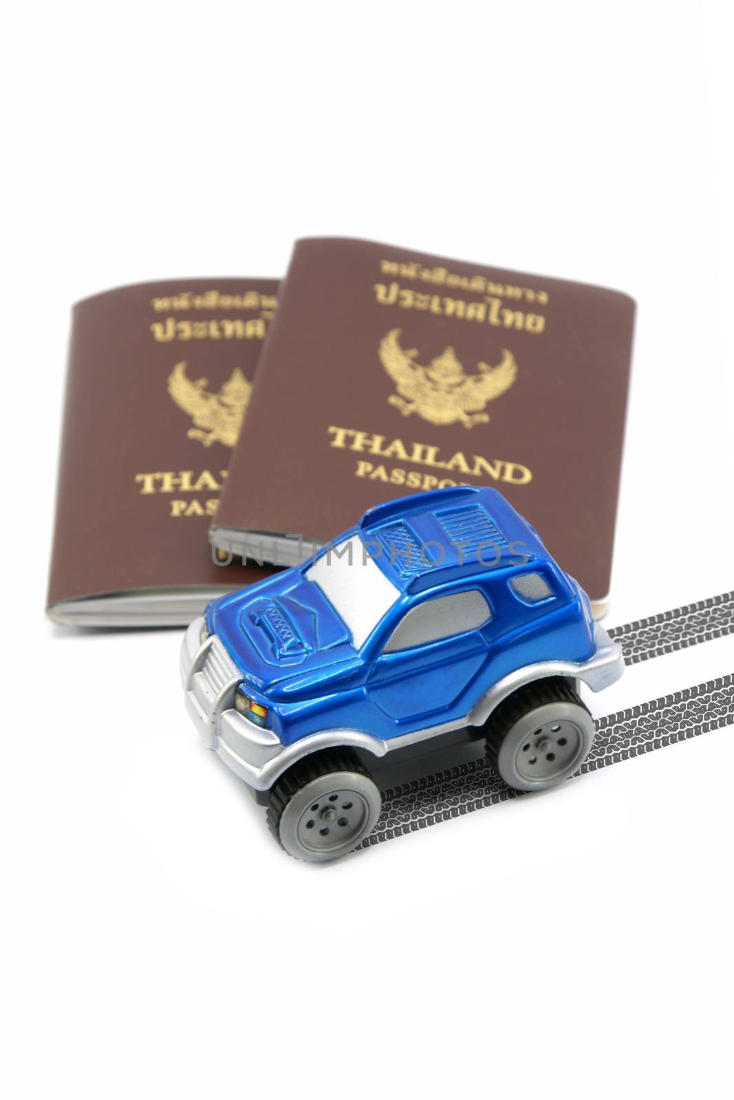 Thailand passport and blue 4wd car for travel concept by mranucha