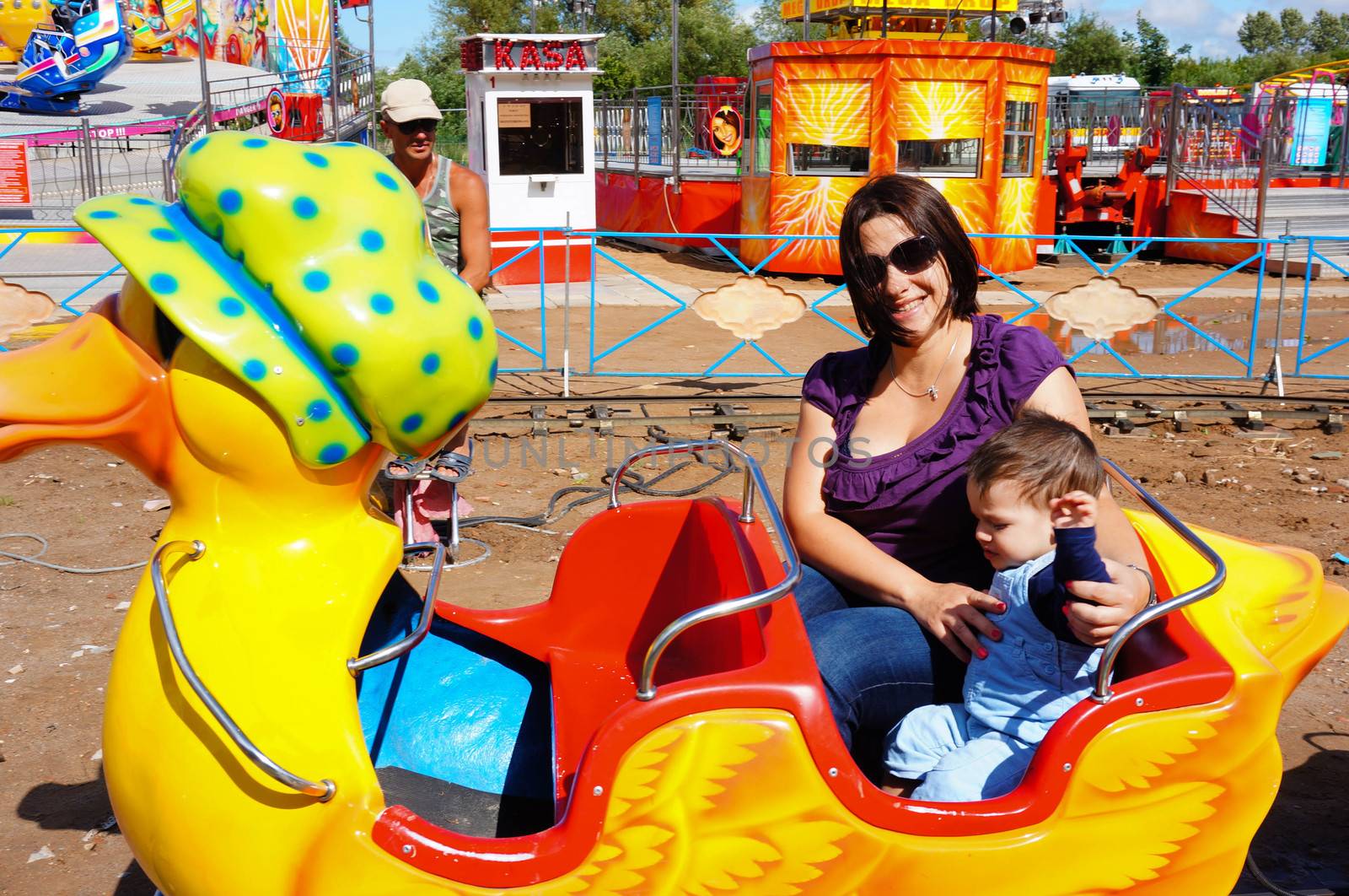 USTRONIE MORSKIE, POLAND - JULY 20, 2015: People on duck train attraction at a fair 