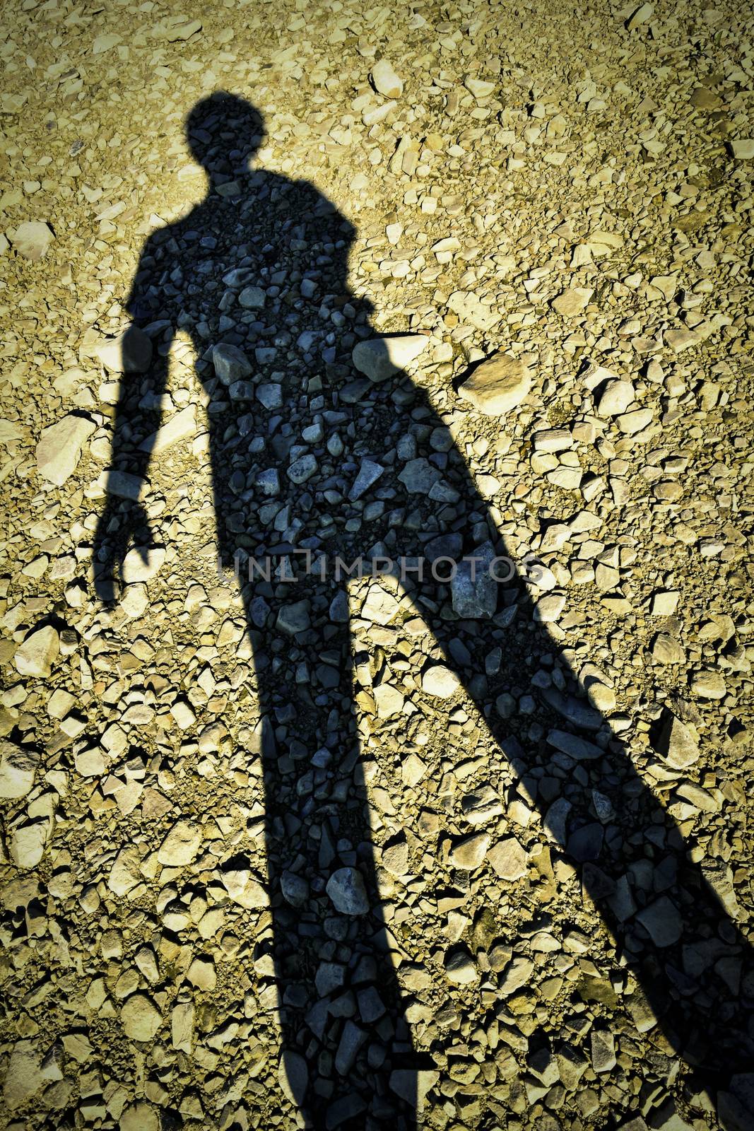 abstract background shadow figures standing on a stone beach