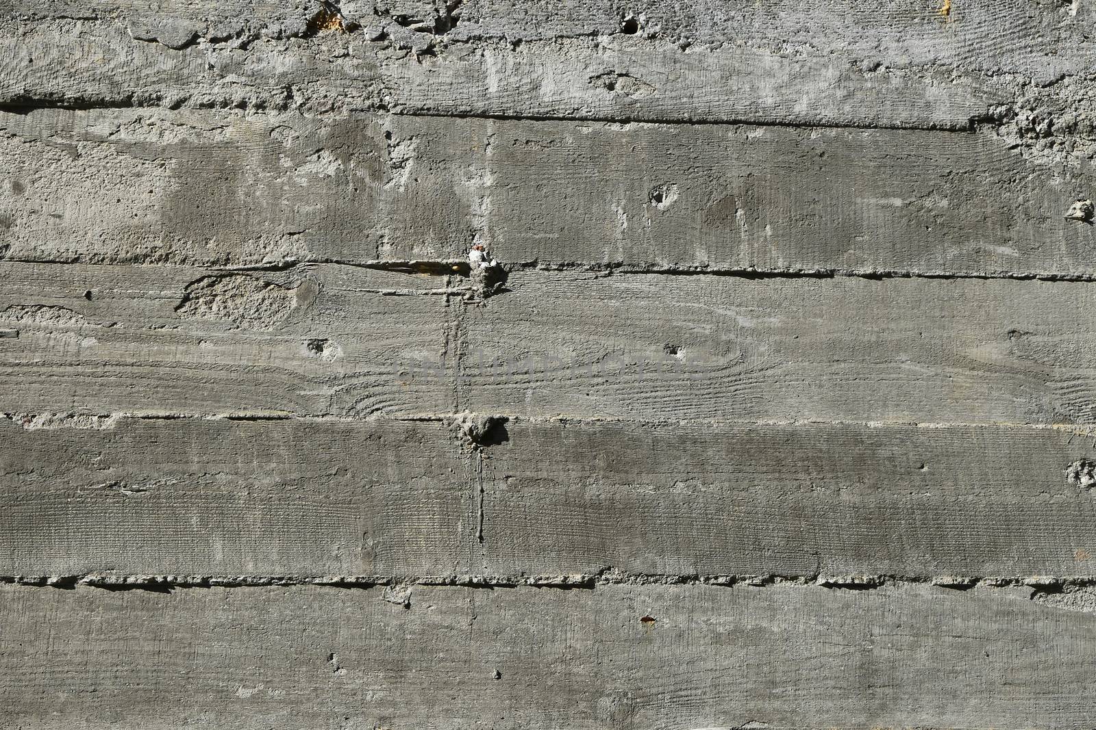 Concrete wall with wooden pattern impress from wooden form board by BreakingTheWalls