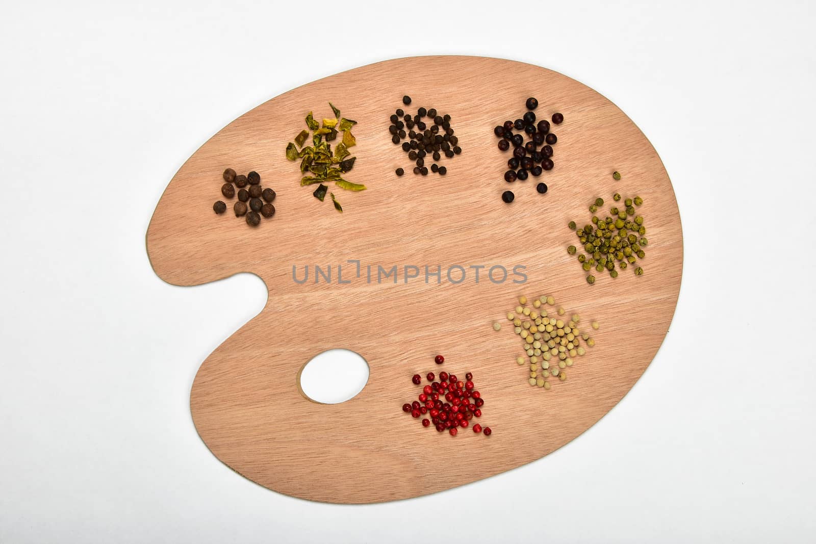 Palette of spices, collection of various spices on wooden palette isolated on white