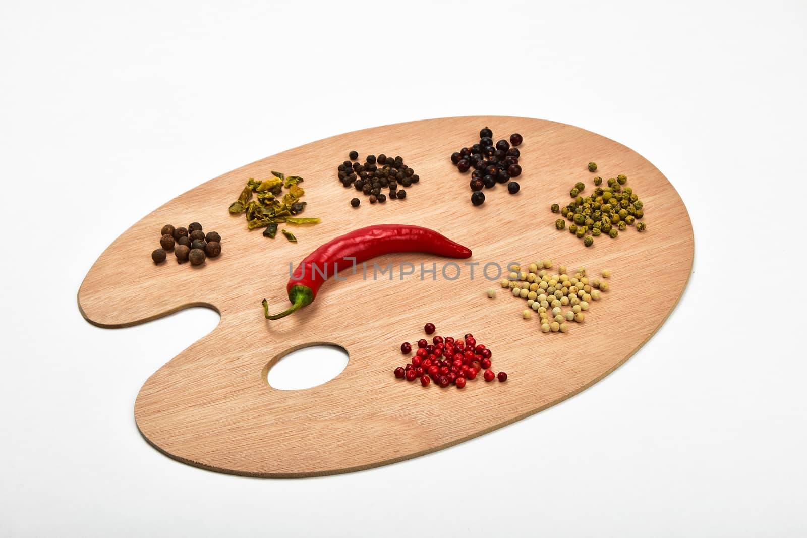 Palette of spices, collection of various spices on wooden palette isolated on white