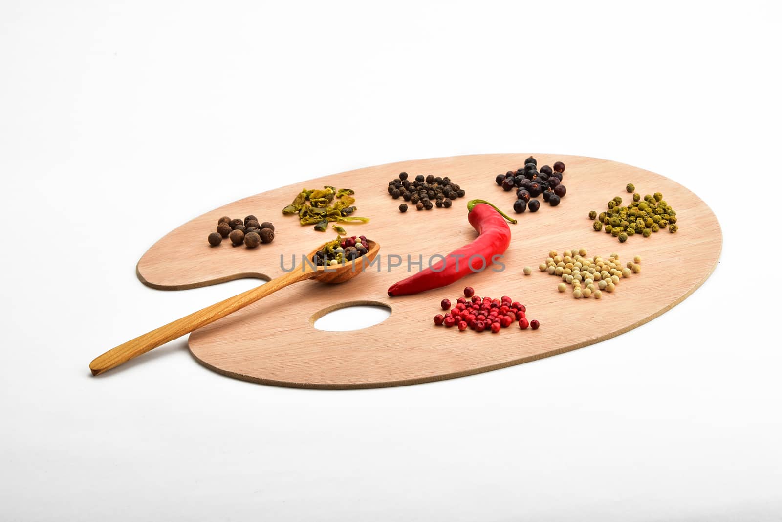 Palette of spices, collection of various spices on wooden palette isolated on white