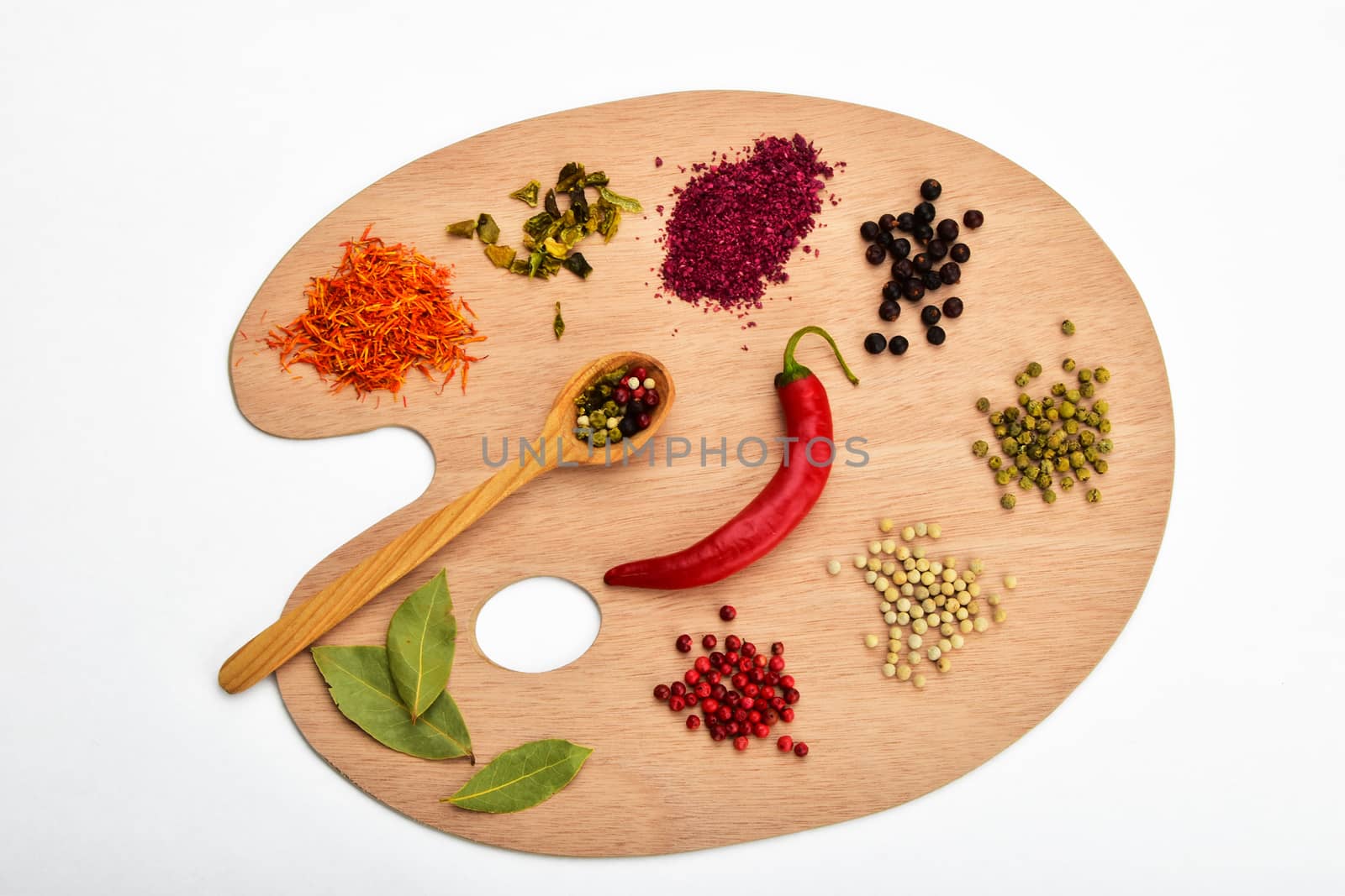 Palette of various spices on wooden palette isolated on white by BreakingTheWalls