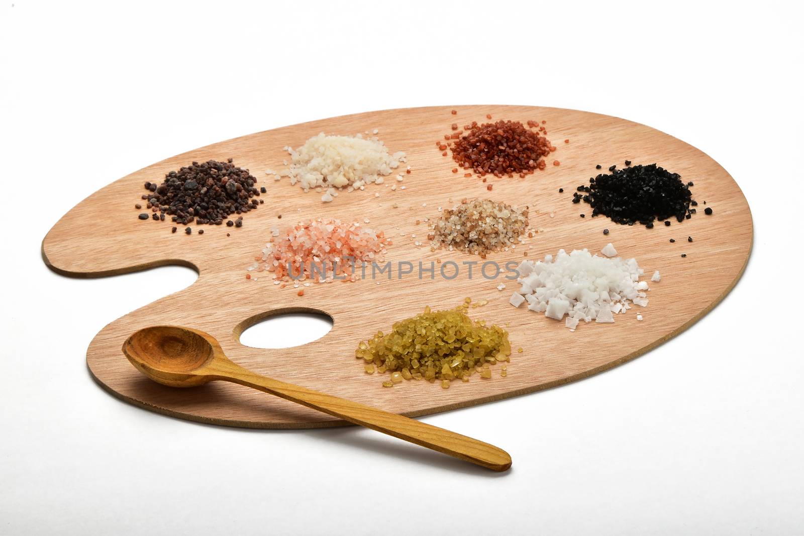 Palette of salt, collection of various salts on wooden palette isolated on white