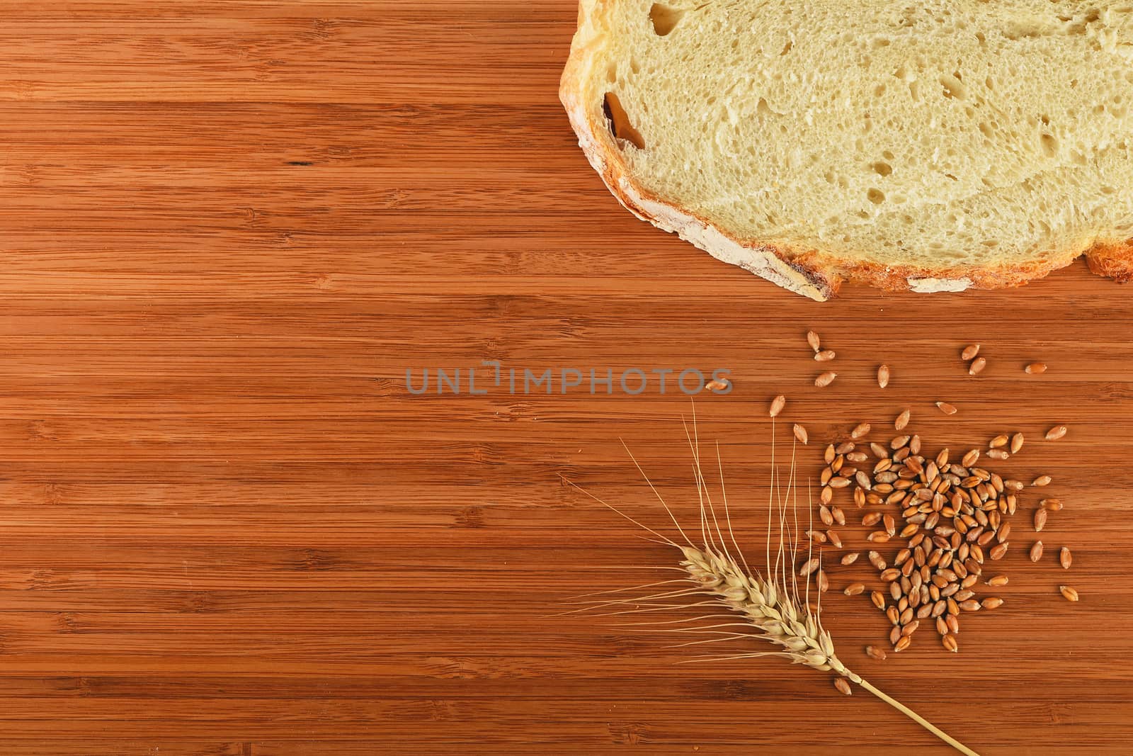 Cutting board with wheat ear, grains and slice of bread by BreakingTheWalls