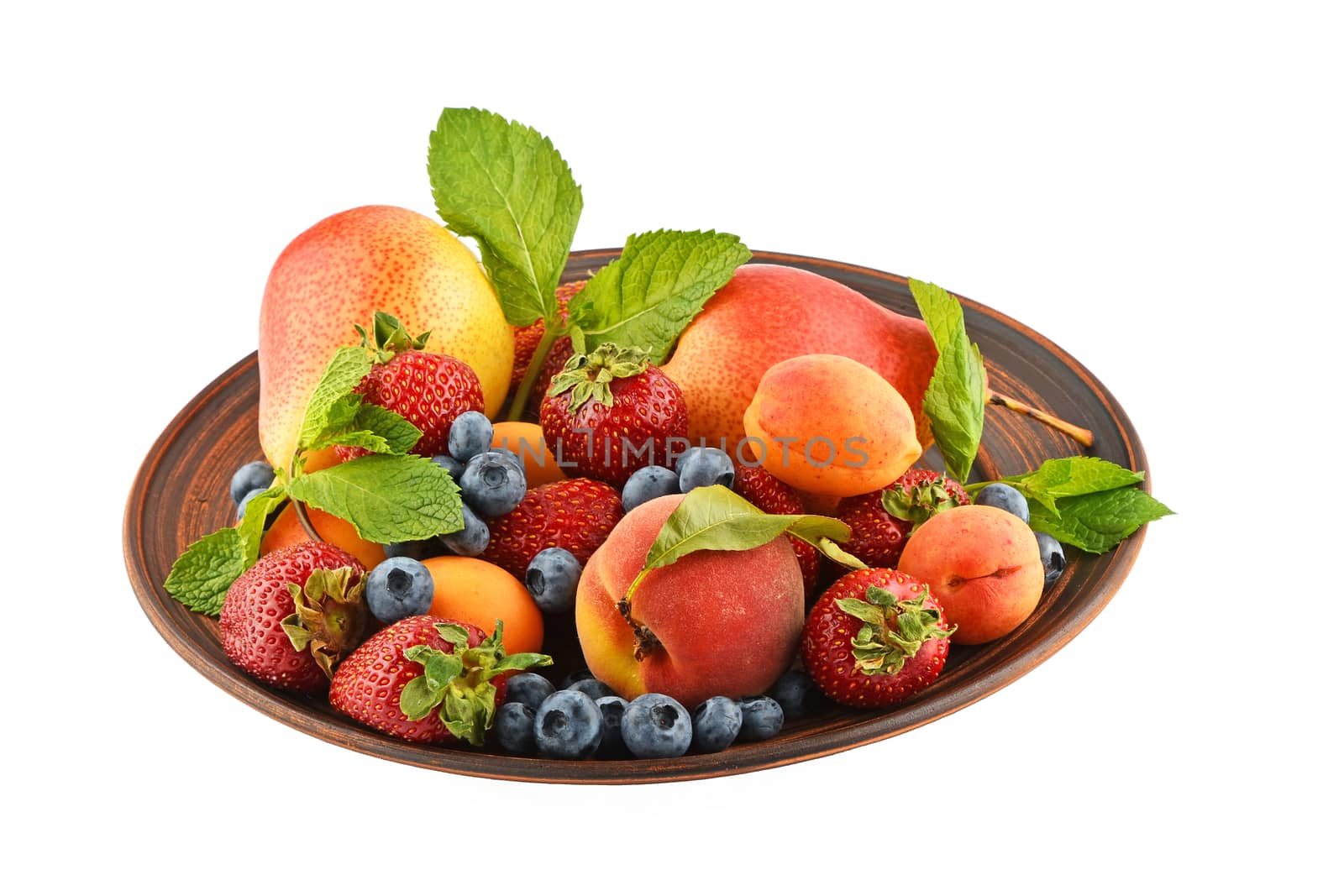 Mellow fresh summer fruits and berries mix with mint leaves in ceramic plate isolated on white, strawberries, blueberries, apricots, peach and pear