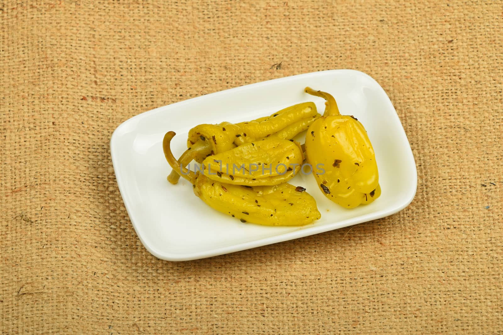 Mediterranean snack of pickled green pepper on canvas by BreakingTheWalls