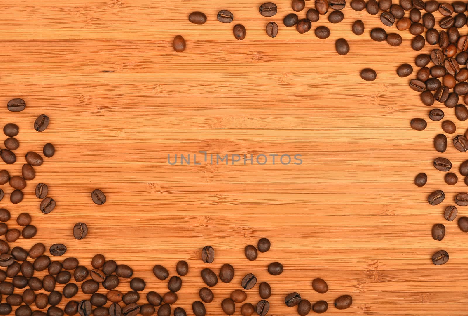 Roasted Arabica coffee espresso beans shape corners border over wooden bamboo board background