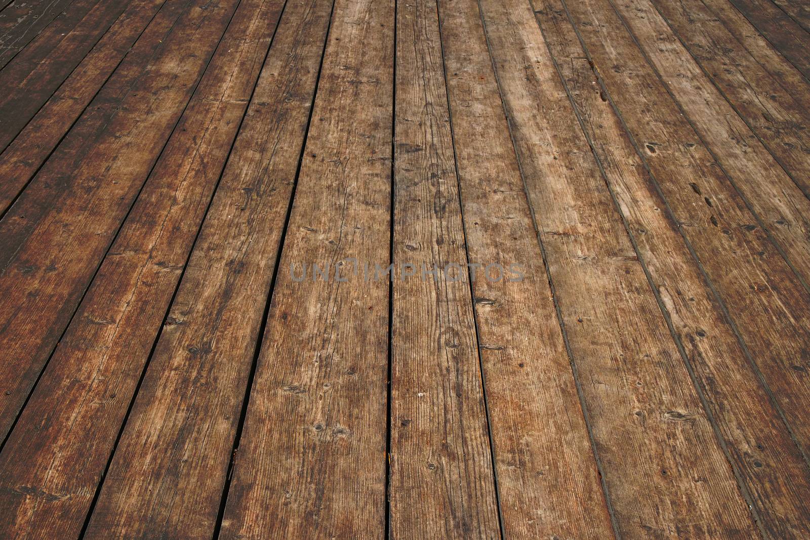 Vintage wooden surface with planks and gaps in perspective by BreakingTheWalls
