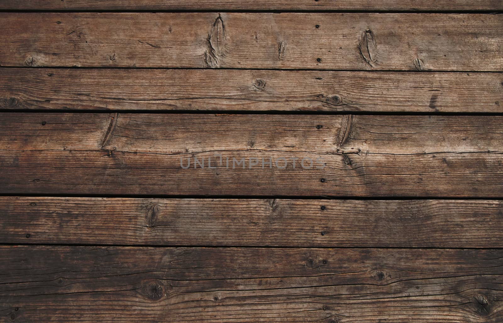 Old vintage rustic aged antique wooden sepia panel with horizontal gaps, planks and chinks