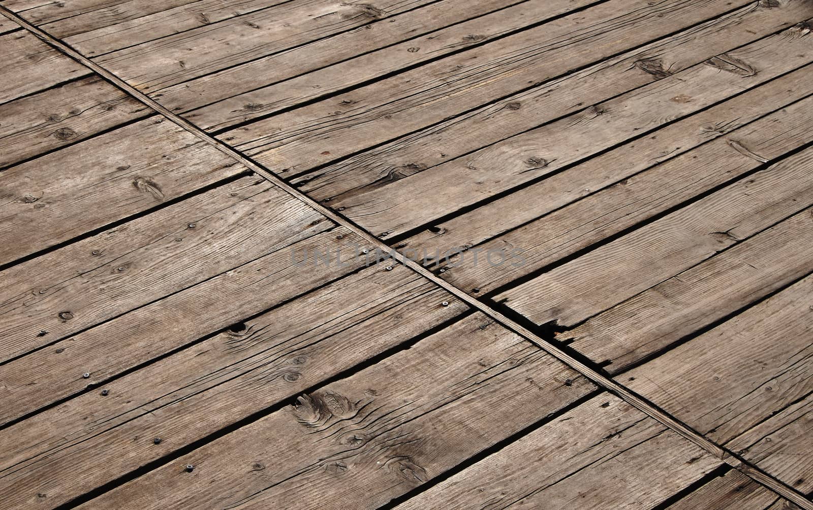 Vintage wooden panel with diagonal planks and gaps by BreakingTheWalls
