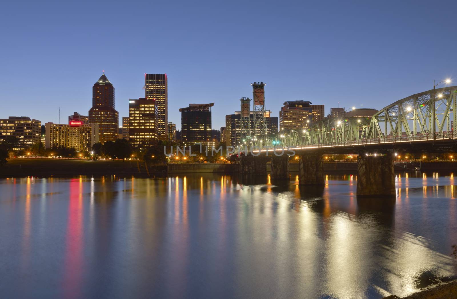 Portland Oregon skyline buildings and bridge at twilight.