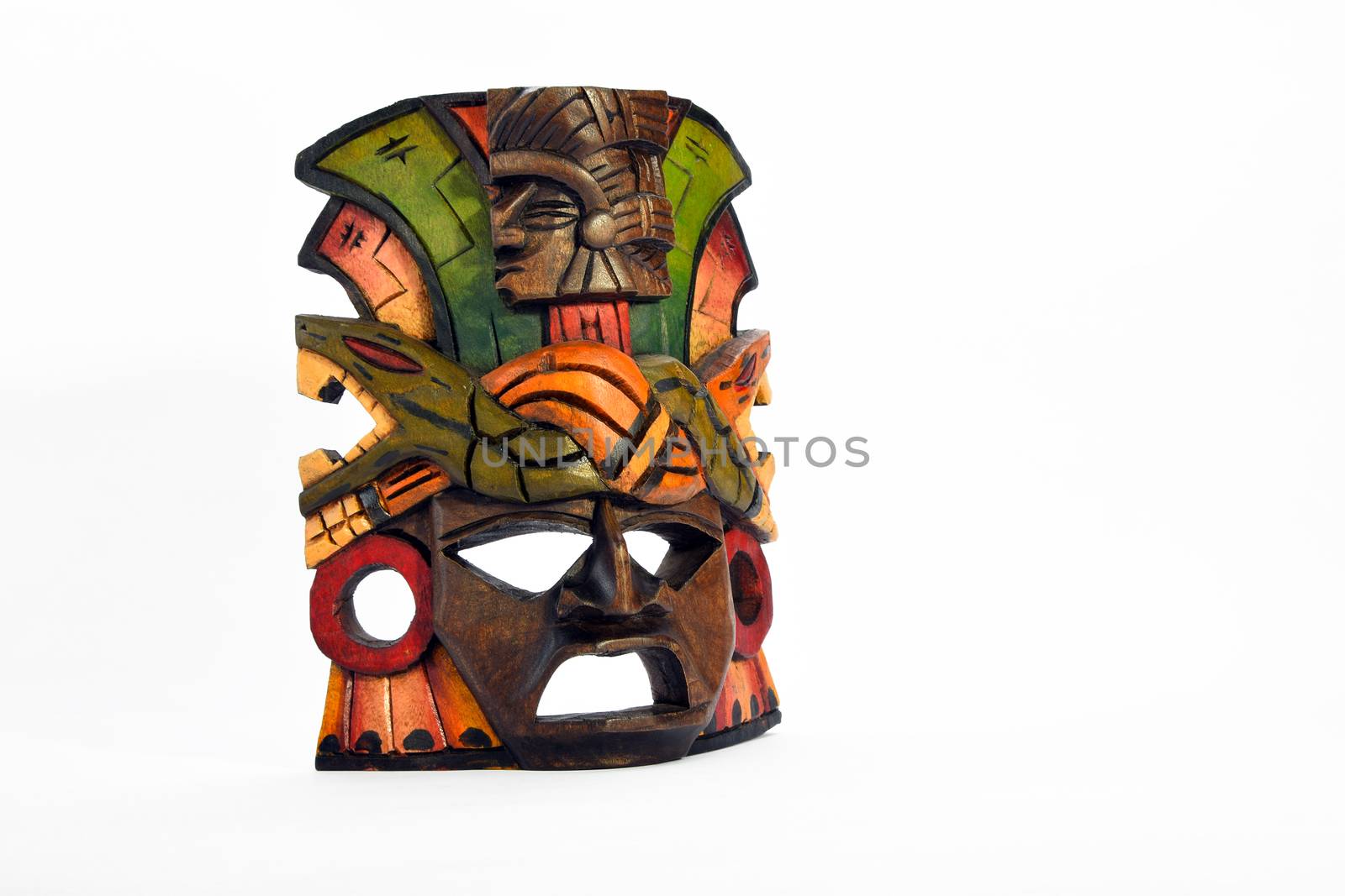 Indian Mayan Aztec wooden mask with anaconda and jaguar isolated on white background