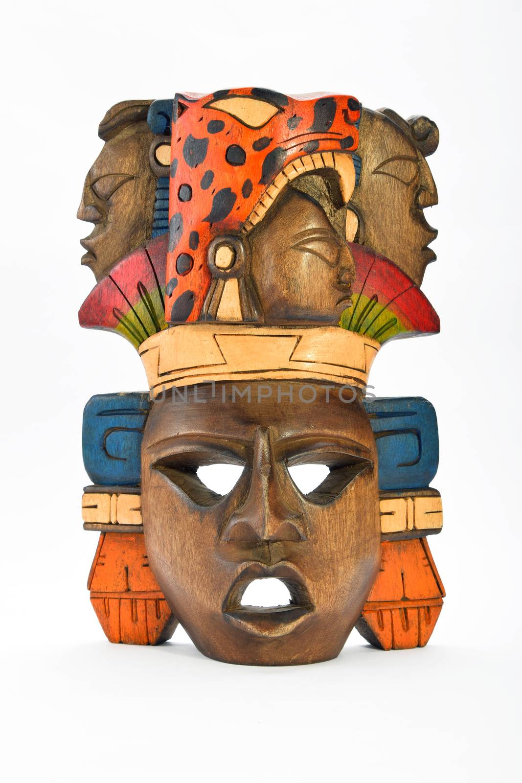 Indian Mayan Aztec wooden painted mask with roaring jaguar and human profiles isolated on white background