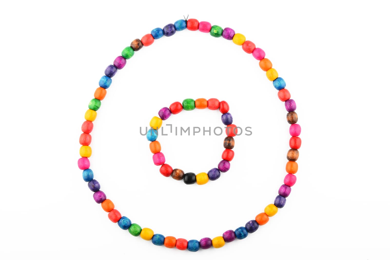Colorful handmade wooden painted round beads necklace and bracelet isolated on white