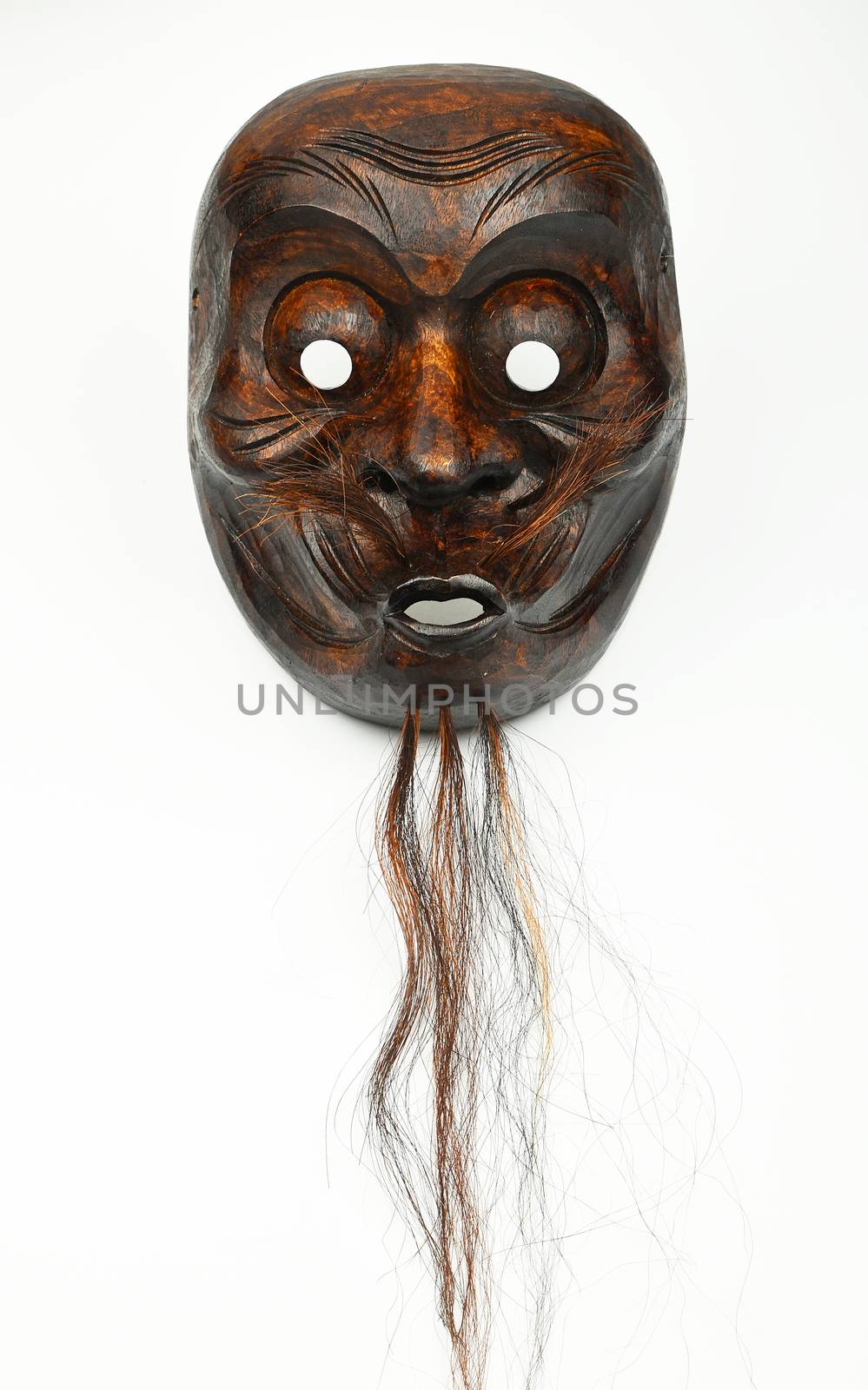 Japanese wooden carved theater mask of human face with beard and moustache isolated on white background