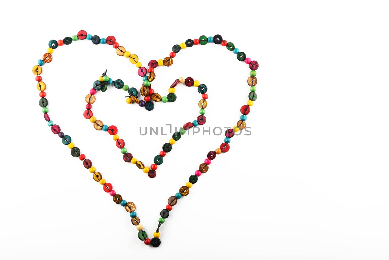 Double heart shaped colorful handmade wooden round beads necklace isolated on white