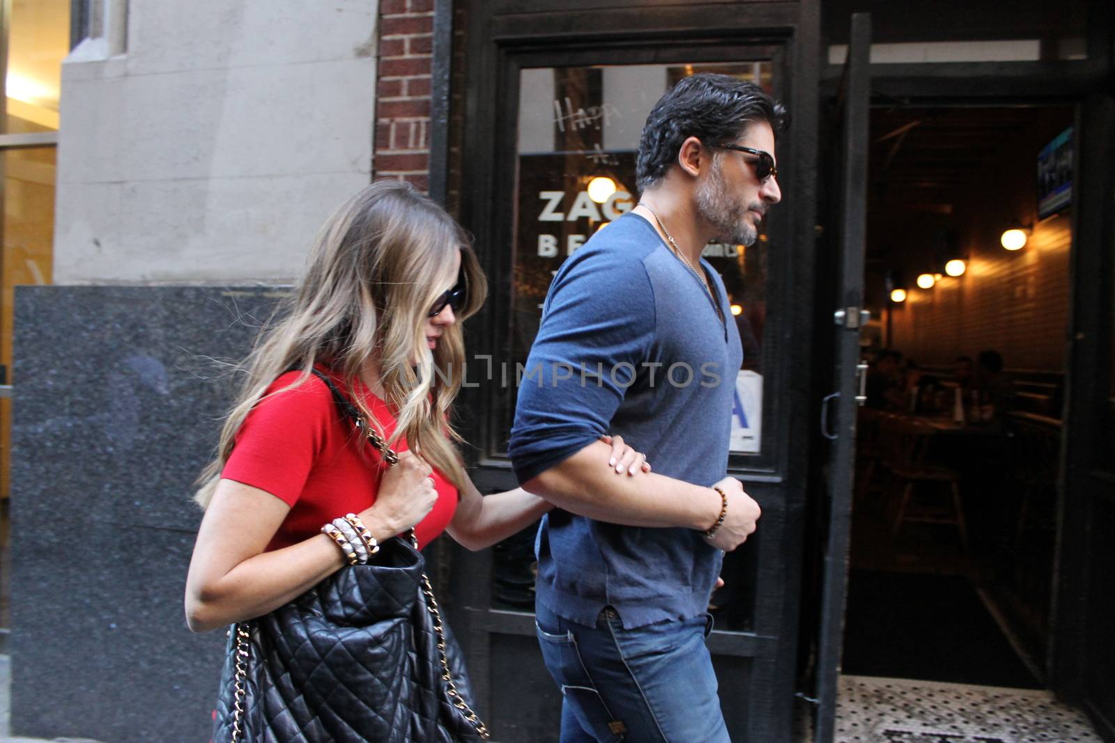 USA, New York: Addicted to cake, vivacious Modern Family superstar Sofia Vergara hurries to her car with Hollywood-hunk fiancee Joe Manganiello after visiting Ron Ben-Israel Cakes in Midtown Manhattan on September 23, 2015. Bakery staff confirmed that the super couple was at the shop; but when asked if the pair had decided to buy their wedding cake from the bakery, one employee revealed that it was all up in the air.