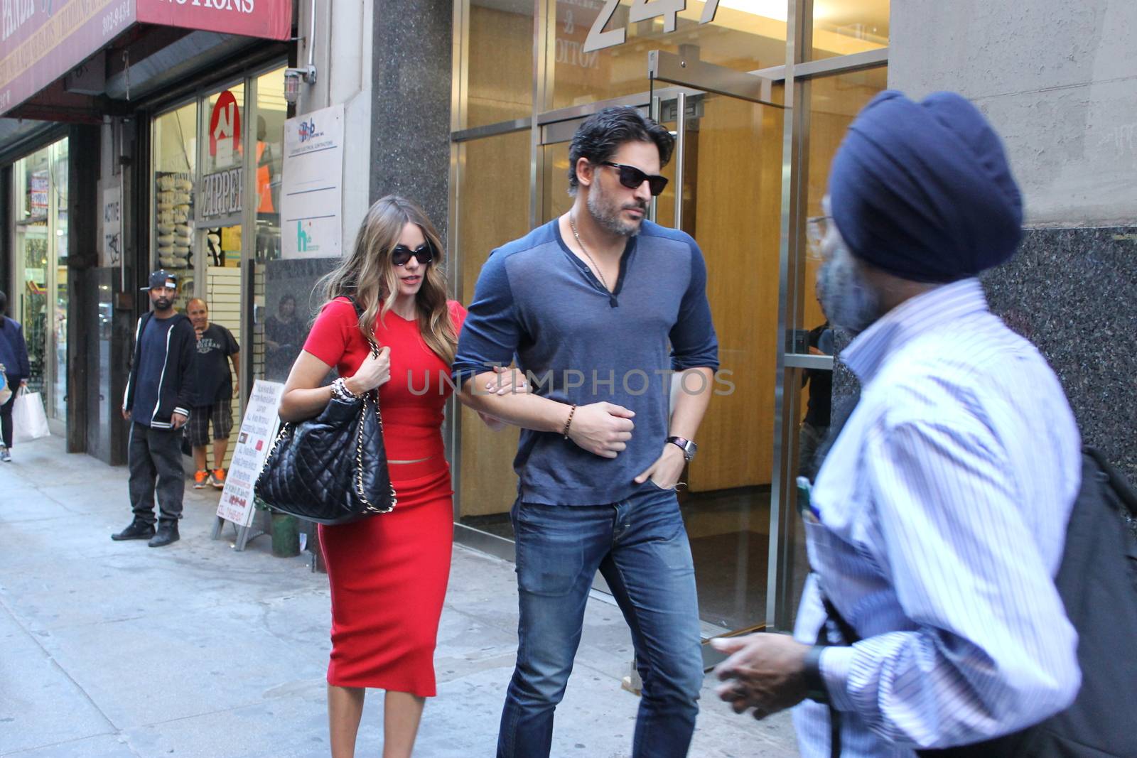 USA, New York: Addicted to cake, vivacious Modern Family superstar Sofia Vergara hurries to her car with Hollywood-hunk fiancee Joe Manganiello after visiting Ron Ben-Israel Cakes in Midtown Manhattan on September 23, 2015. Bakery staff confirmed that the super couple was at the shop; but when asked if the pair had decided to buy their wedding cake from the bakery, one employee revealed that it was all up in the air.