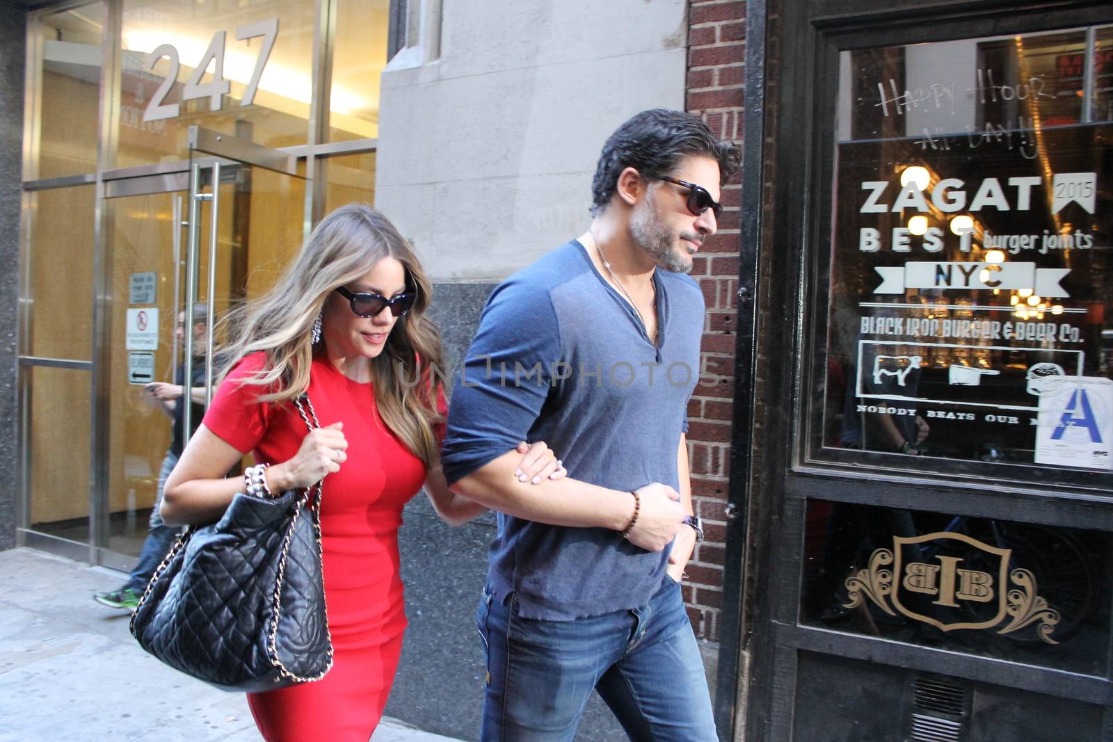 USA, New York: Addicted to cake, vivacious Modern Family superstar Sofia Vergara hurries to her car with Hollywood-hunk fiancee Joe Manganiello after visiting Ron Ben-Israel Cakes in Midtown Manhattan on September 23, 2015. Bakery staff confirmed that the super couple was at the shop; but when asked if the pair had decided to buy their wedding cake from the bakery, one employee revealed that it was all up in the air.