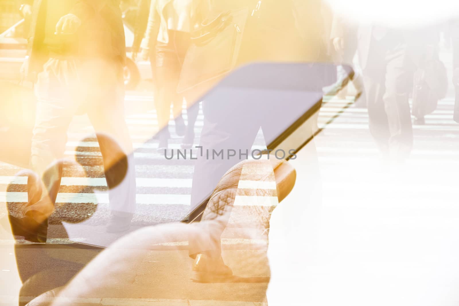 Double exposure of using smart phone and people walking on street background