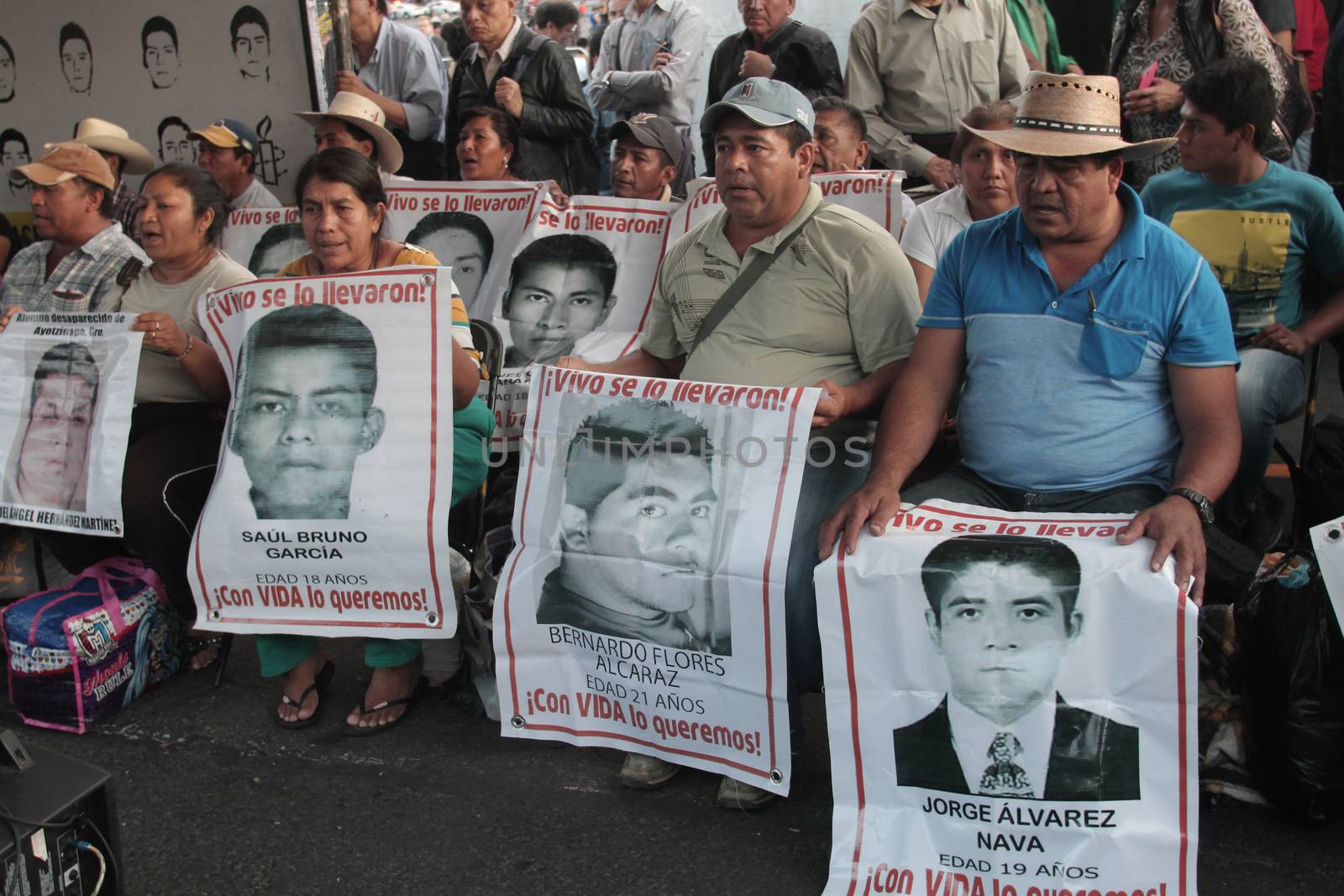 MEXICO, Mexico City : Fathers and relatives of the 43 missing students from Ayotzinapa arrive at Zocalo Square in Mexico City on September 23, 2015. Parents of 43 Mexican students who disappeared last year began a 43-hour hunger strike on Wednesday, a day before meeting with President Enrique Pena Nieto ahead of the case's anniversary.