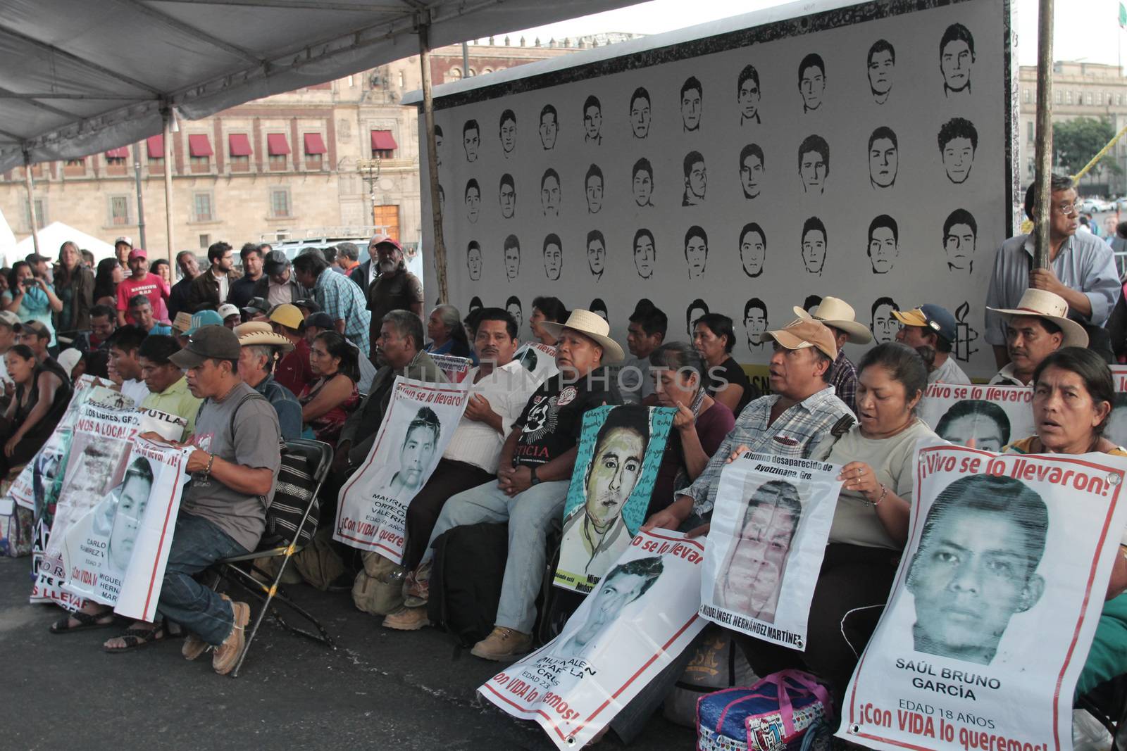 MEXICO, Mexico City : Fathers and relatives of the 43 missing students from Ayotzinapa arrive at Zocalo Square in Mexico City on September 23, 2015. Parents of 43 Mexican students who disappeared last year began a 43-hour hunger strike on Wednesday, a day before meeting with President Enrique Pena Nieto ahead of the case's anniversary.