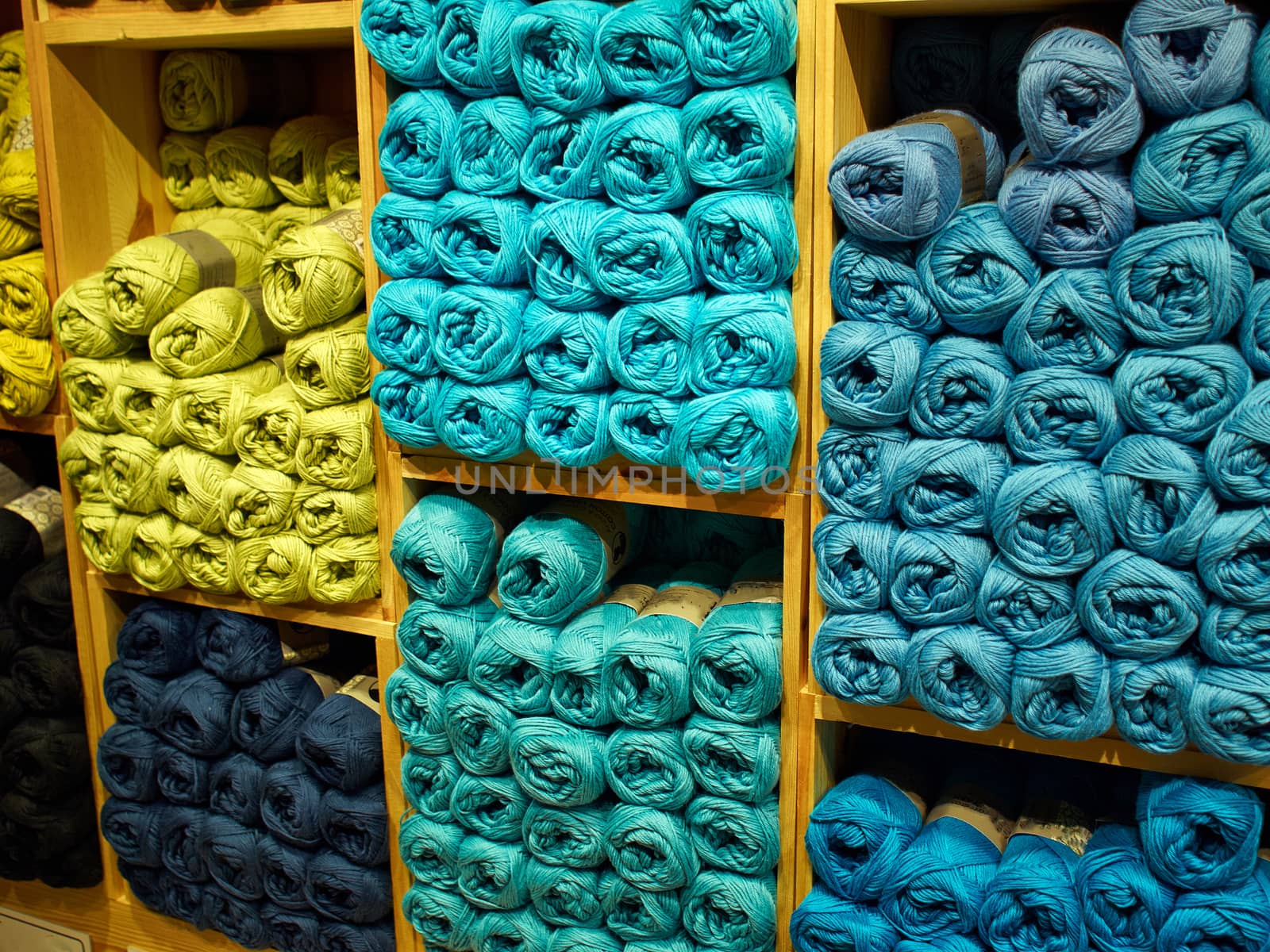 Selection of colorful yarn wool on display in a shop 