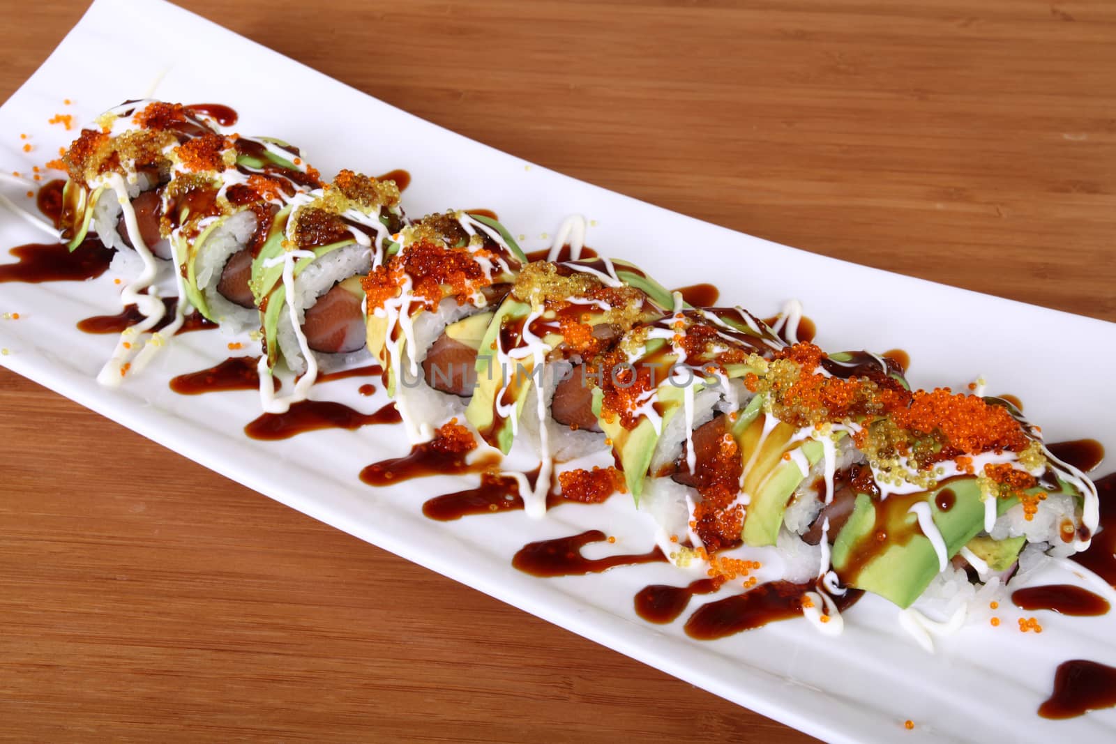 plate of sushi decorated with fish eggs