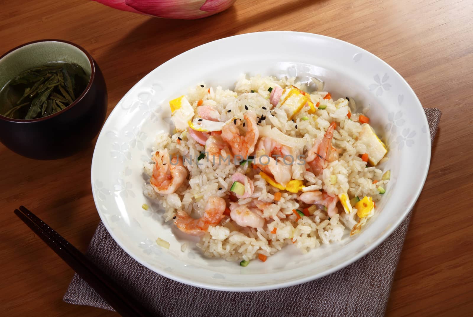 Japanese cooking rice with seafood on wood table