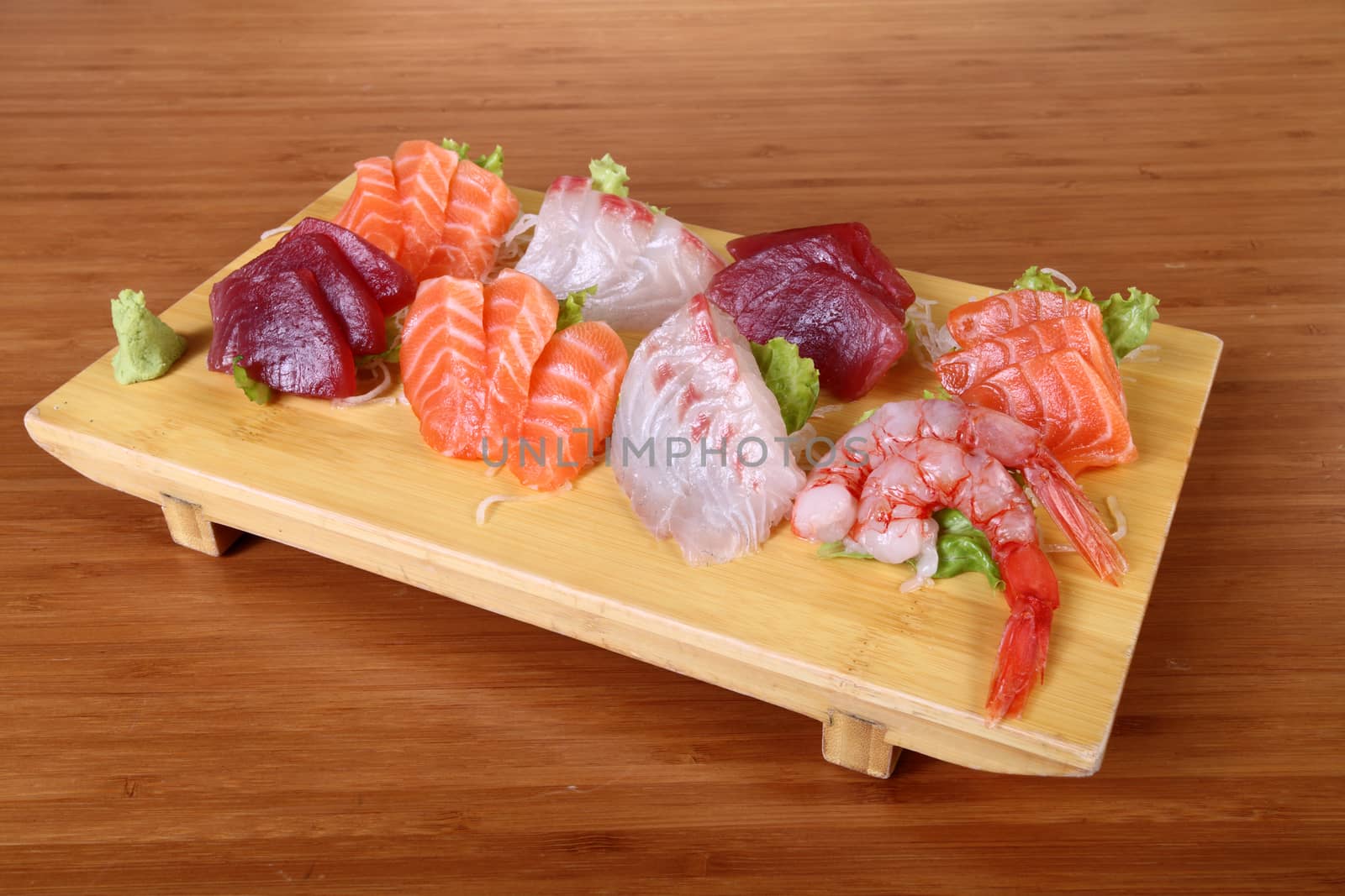 sashimi on wooden tray