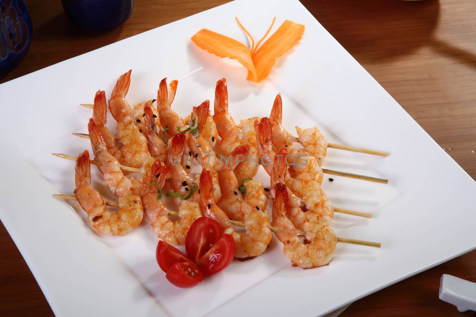 shrimp skewers on rectangular plate
