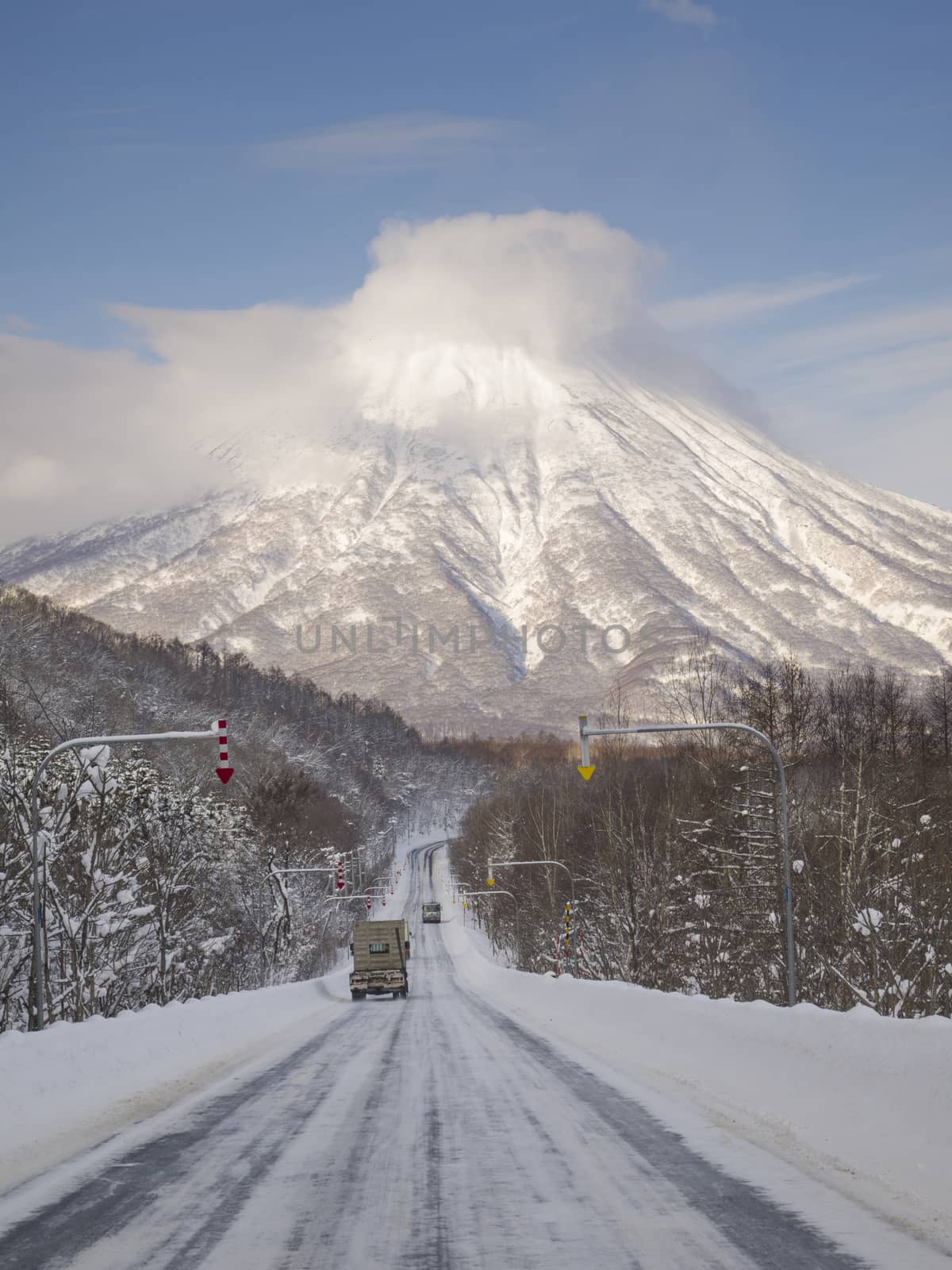 Road in winter which continues to Mt. Yotei, an active stratovolcano located in Shikotsu-Toya National Park, Hokkaido, Japan. It is one of the 100 famous mountains in Japan.