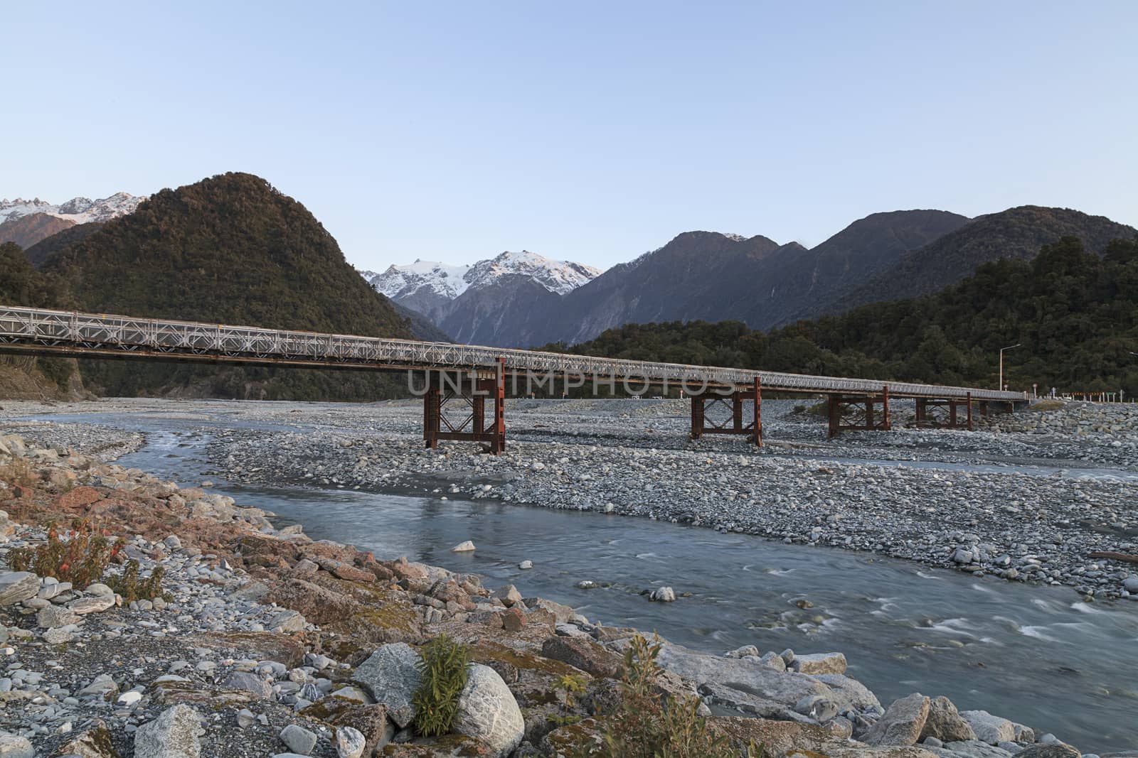 Bridge across Waiho river, Franz Josef (Ka Roimata o Hinehukatere in Maori), West Coast region, South Island, New Zealand.