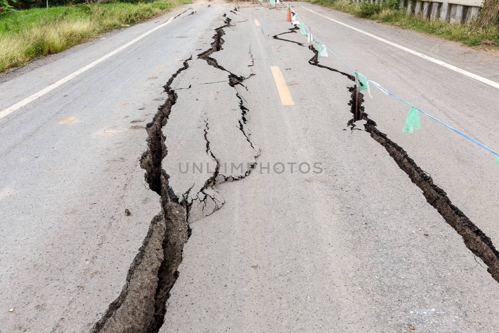 Asphalt road cracked and broken from earthquake.