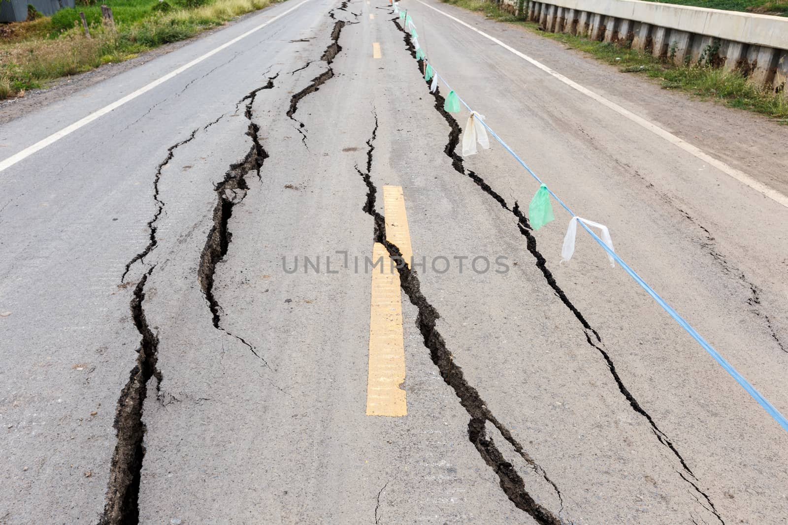 Asphalt road cracked and broken from earthquake.