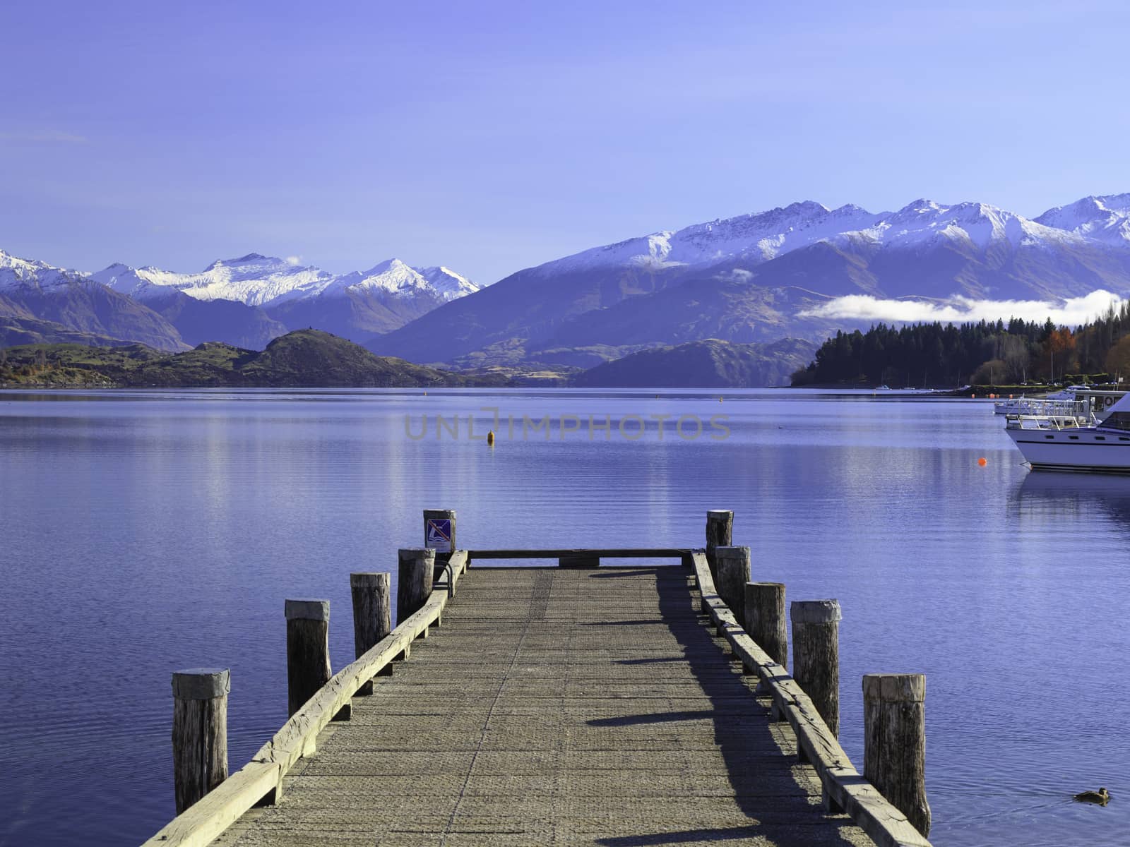 Beautiful View of Lake Wanaka and its jetty in autumn, Otago region, South Island, New Zealand.