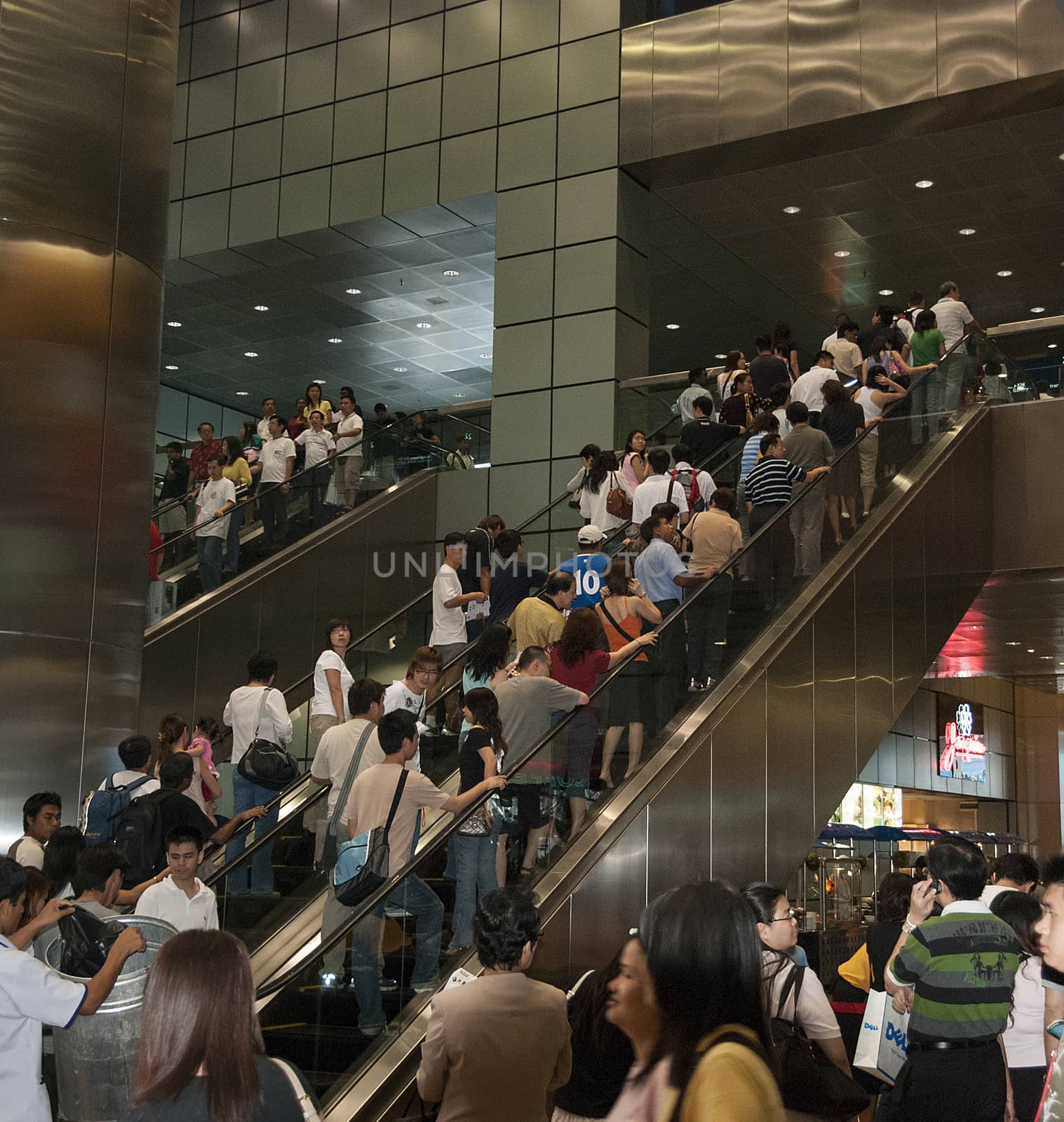 people crown on escalator by compuinfoto