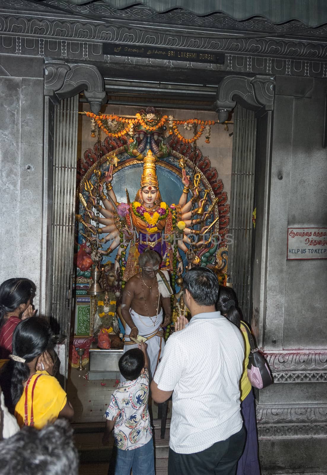 SINGAPORE,- MARCH 10, 2007 : People enjoying inside Kaliamman Temple in Singapore on March 10 2007, this temple is the biggest hindu temple in Singapore